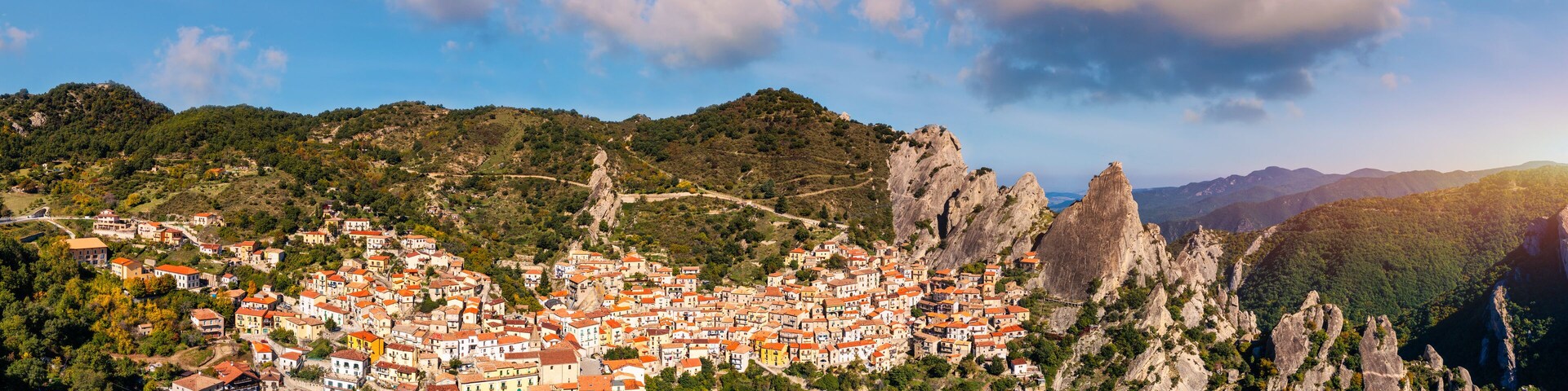 The picturesque village of Castelmezzano, province of Potenza, Basilicata, Italy. Cityscape aerial view of medieval city of Castelmazzano, Italy. Castelmezzano village in Apennines Dolomiti Lucane.