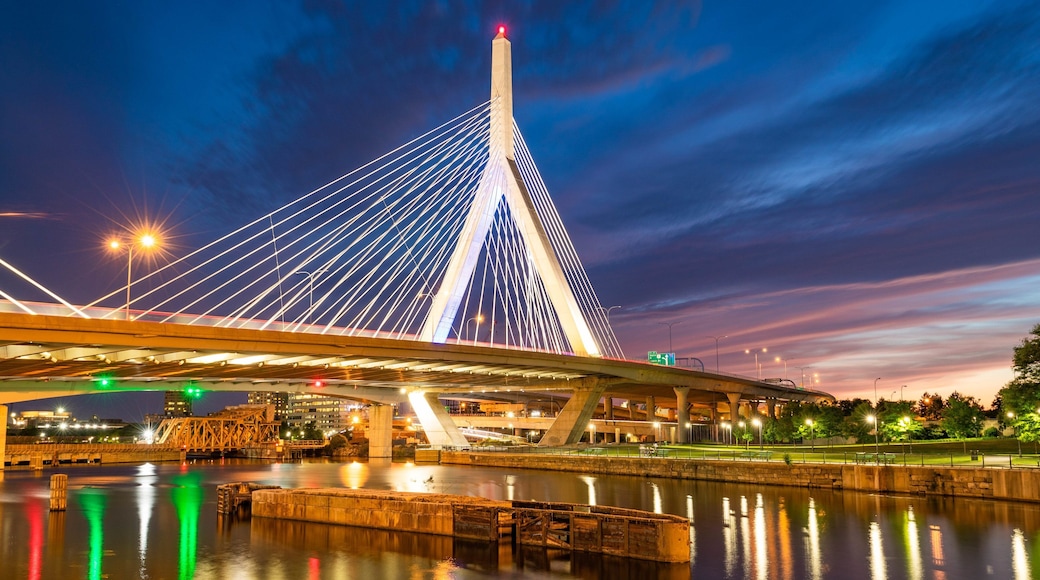 Zakim Bunker Hill Bridge showing night scenes, a sunset and a river or creek