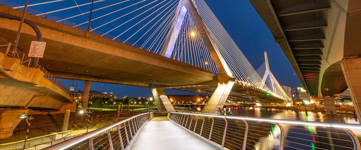 Zakim Bunker Hill Bridge showing night scenes, a bridge and a bay or harbor