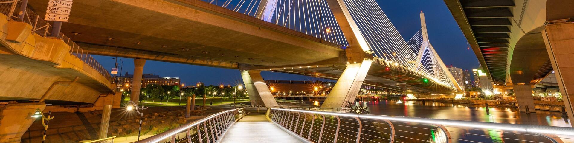 Zakim Bunker Hill Bridge showing night scenes, a bridge and a bay or harbor