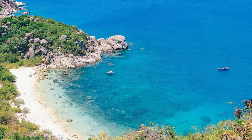 Beautiful tropical beach of Binh Ba, the paradise island with the coast, white sand, clean water, boat, and blue sky. Binh Ba island is a popular tourist destination in Cam Ranh, Nha Trang, Vietnam