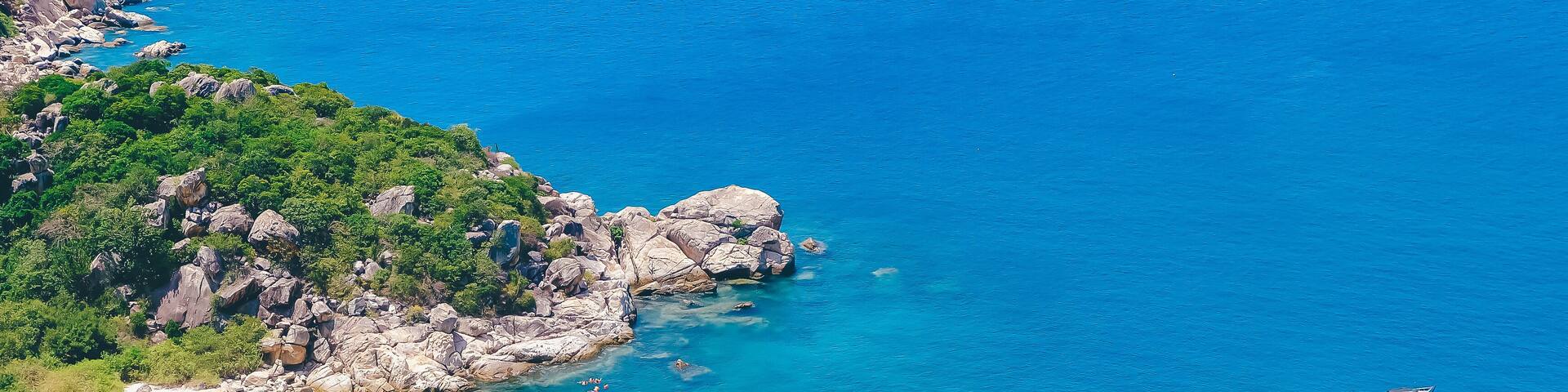 Beautiful tropical beach of Binh Ba, the paradise island with the coast, white sand, clean water, boat, and blue sky. Binh Ba island is a popular tourist destination in Cam Ranh, Nha Trang, Vietnam