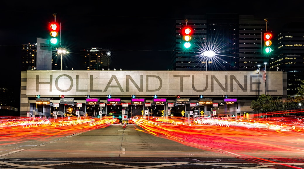 Holland Tunnel toll booth by night. The Holland Tunnel is a highway tunnel under the Hudson River between New York and Jersey City