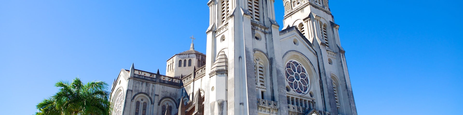 A large cathedral with two tall spires and a large rose window.
