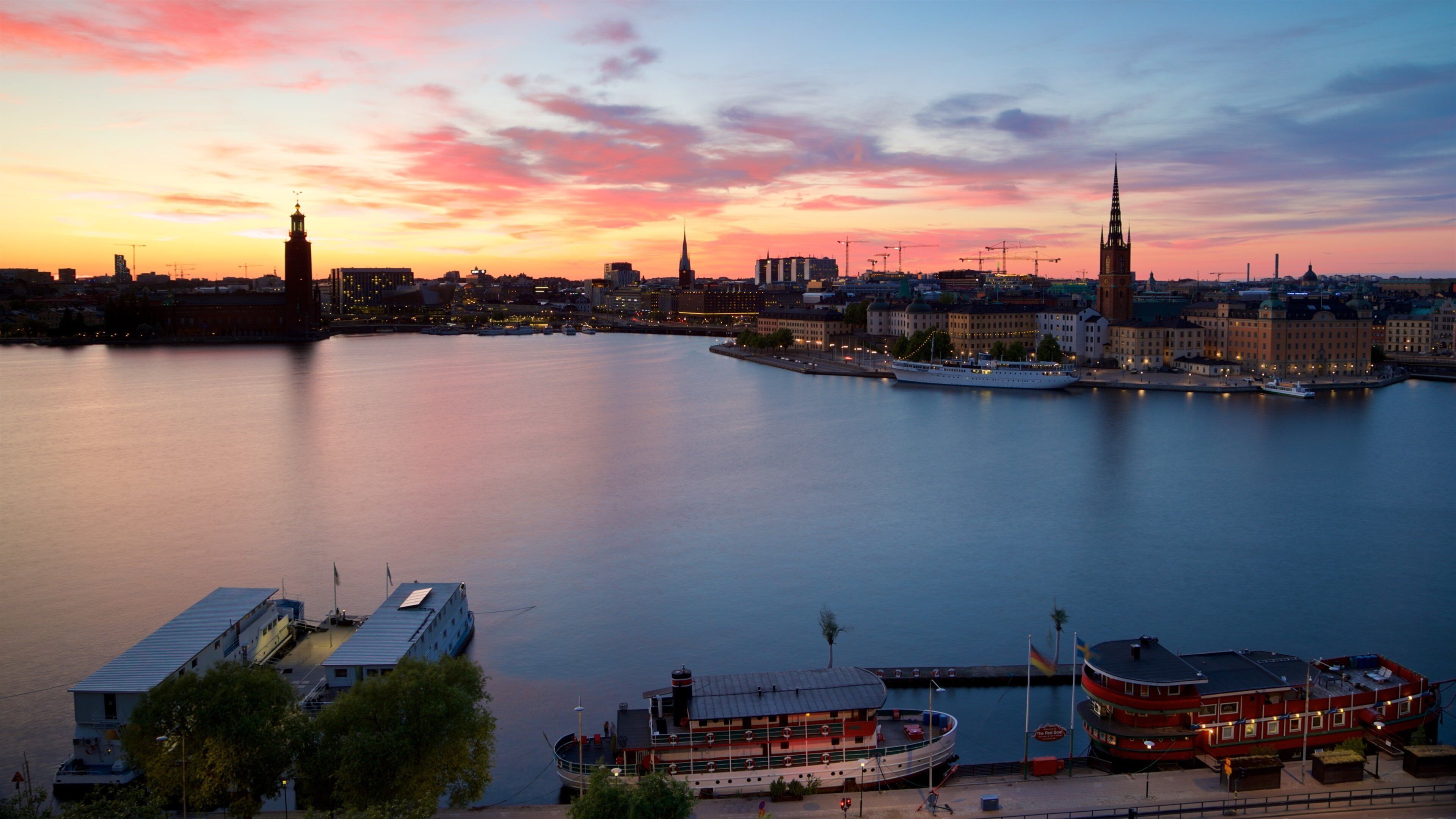 Monteliusvagen showing a sunset, landscape views and a city
