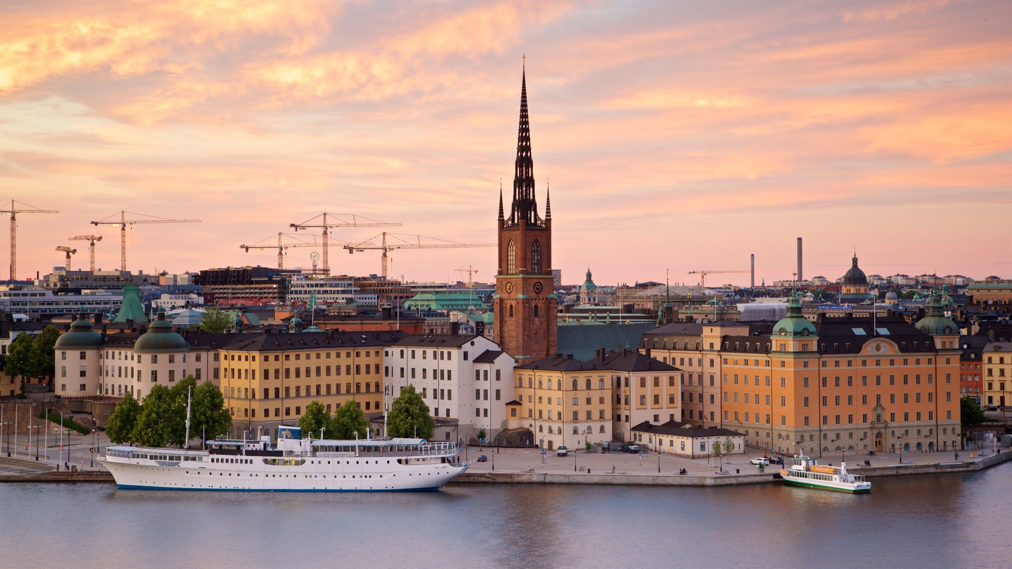 Monteliusvagen showing landscape views, a bay or harbor and a sunset