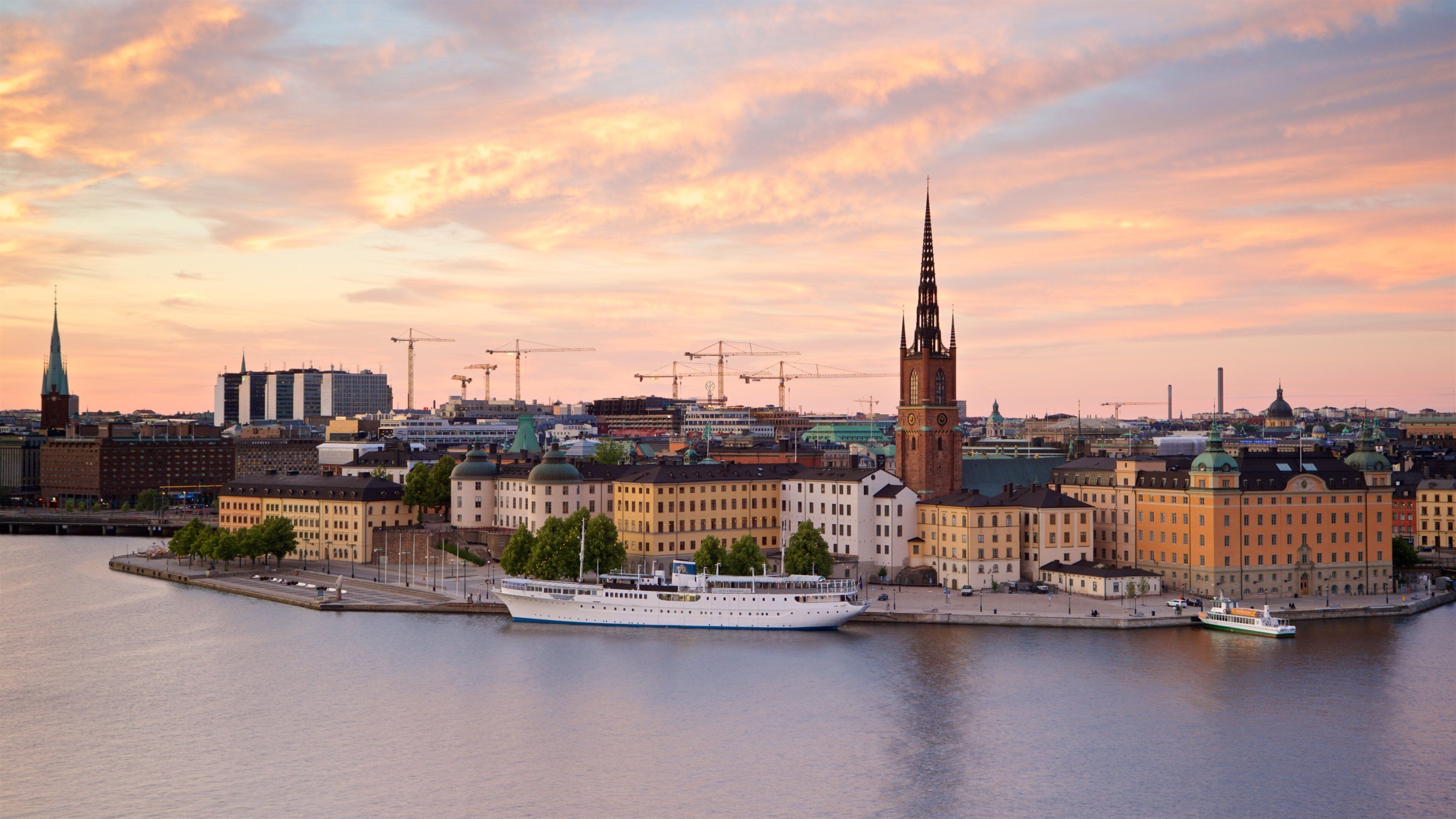Söder Mälarstrand which includes a sunset, a city and a bay or harbor