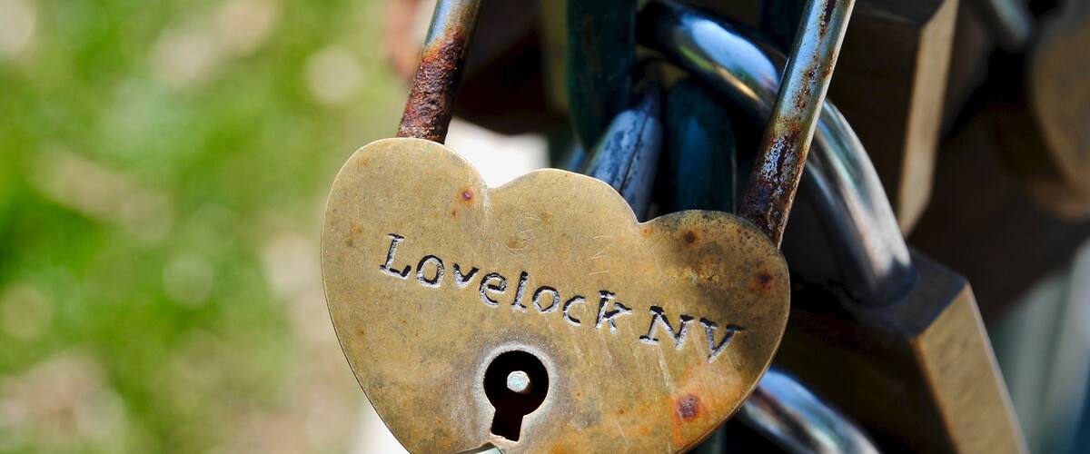 Lovelock, Nevada, USA - Lovers Lock Plaza in the shaded area at the back of the Court House where couples symbolise their love by attaching a padlock to an “endless chain.”