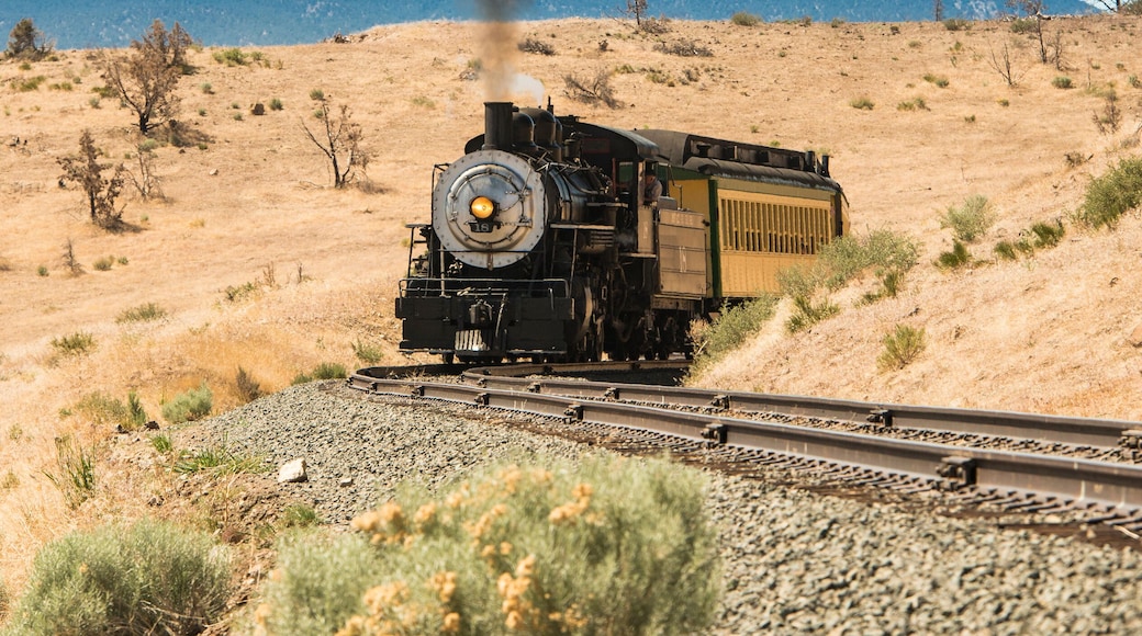 Steam trail driving though Nevada desert. Virgina & Truckee Railroad