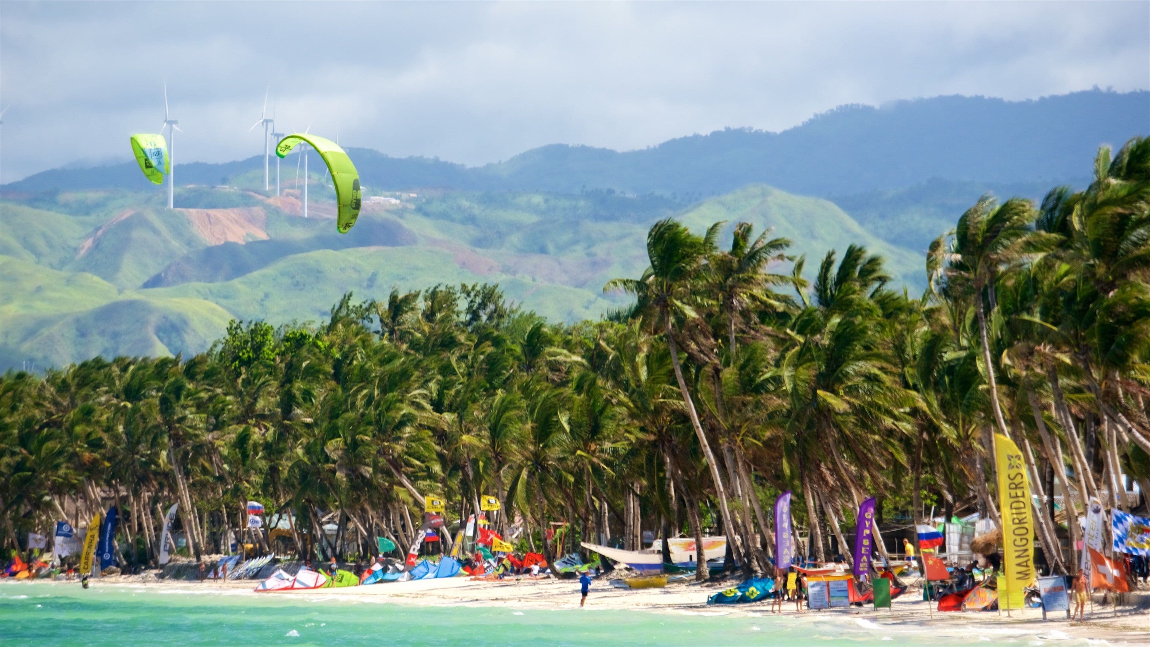 Bulabog Beach featuring parasailing, a beach and tropical scenes