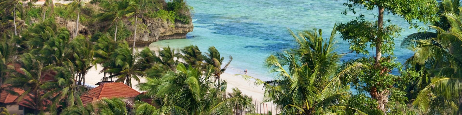 Mont Luho mettant en vedette baie ou port, scĂšnes tropicales et plage