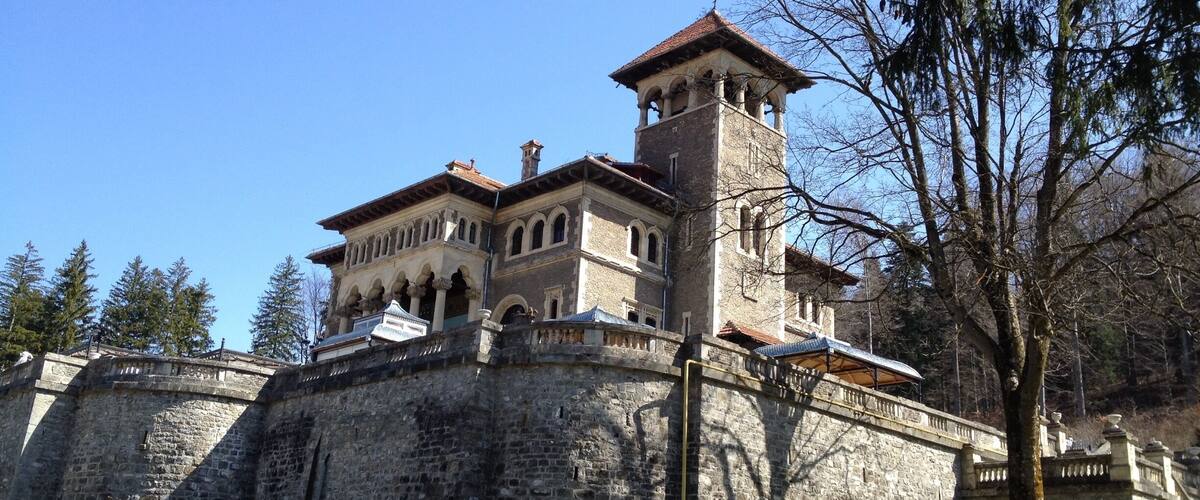 Cantacuzino Castle is situated on Zamora Street in Bușteni, Romania. The building, whose construction was completed in 1911, was conducted by the architect Gregory Cerchez at the request of Prince George Grigore Cantacuzino. It is built in Neo-Romanian style; the total surface of the estate is over 3,000 square meters.
The castle belonged to the Cantacuzino family until the forced nationalization of 1948, when it became a sanatorium for the Ministry of Internal Affair. During the communist period, the original furniture was removed and a part of the interior walls were painted over. After 1989, the castle was returned to Cantacuzino descendants, who sold it to private investors in 2004.