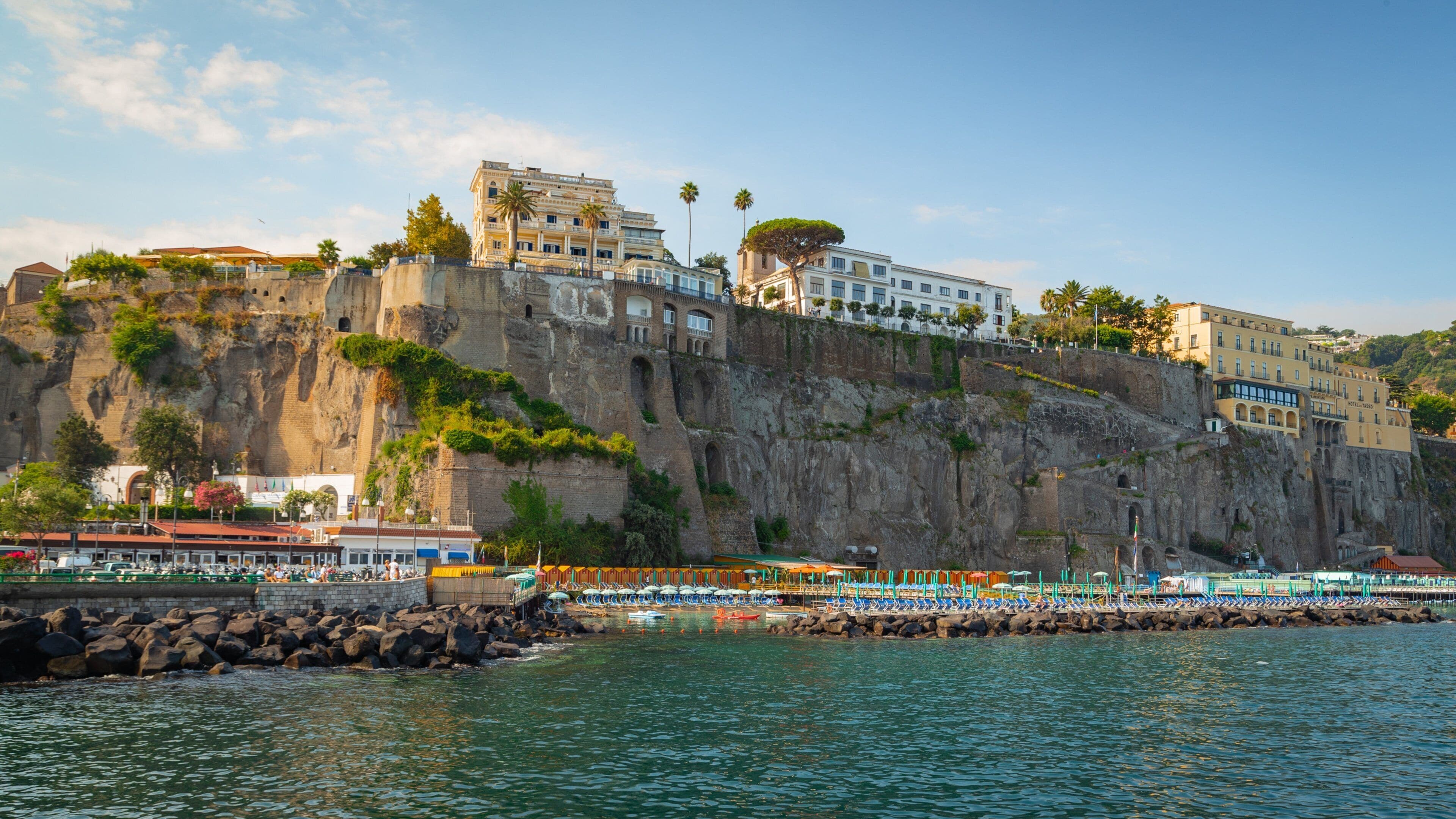 Port of Sorrento which includes rugged coastline, general coastal views and a coastal town