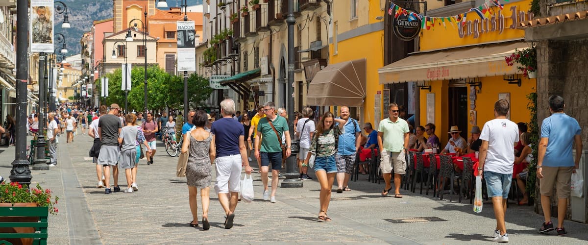 Corso Italia showing street scenes as well as a small group of people