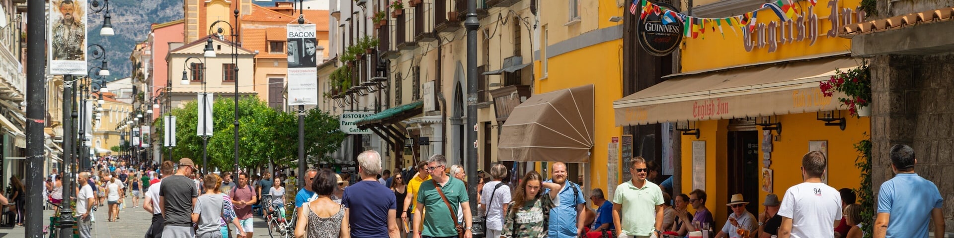 Corso Italia showing street scenes as well as a small group of people