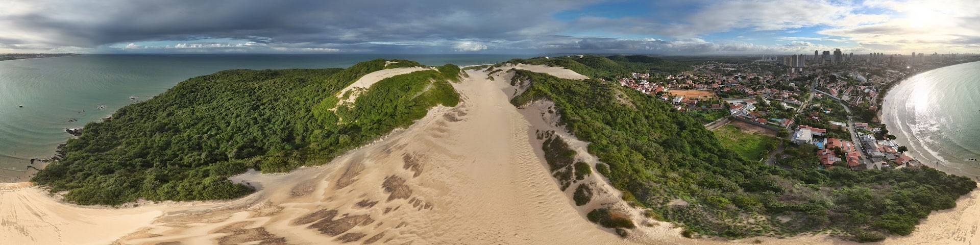 360 aerial photo taken with drone of Morro do Careca in Ponta Negra, Natal, Brazil