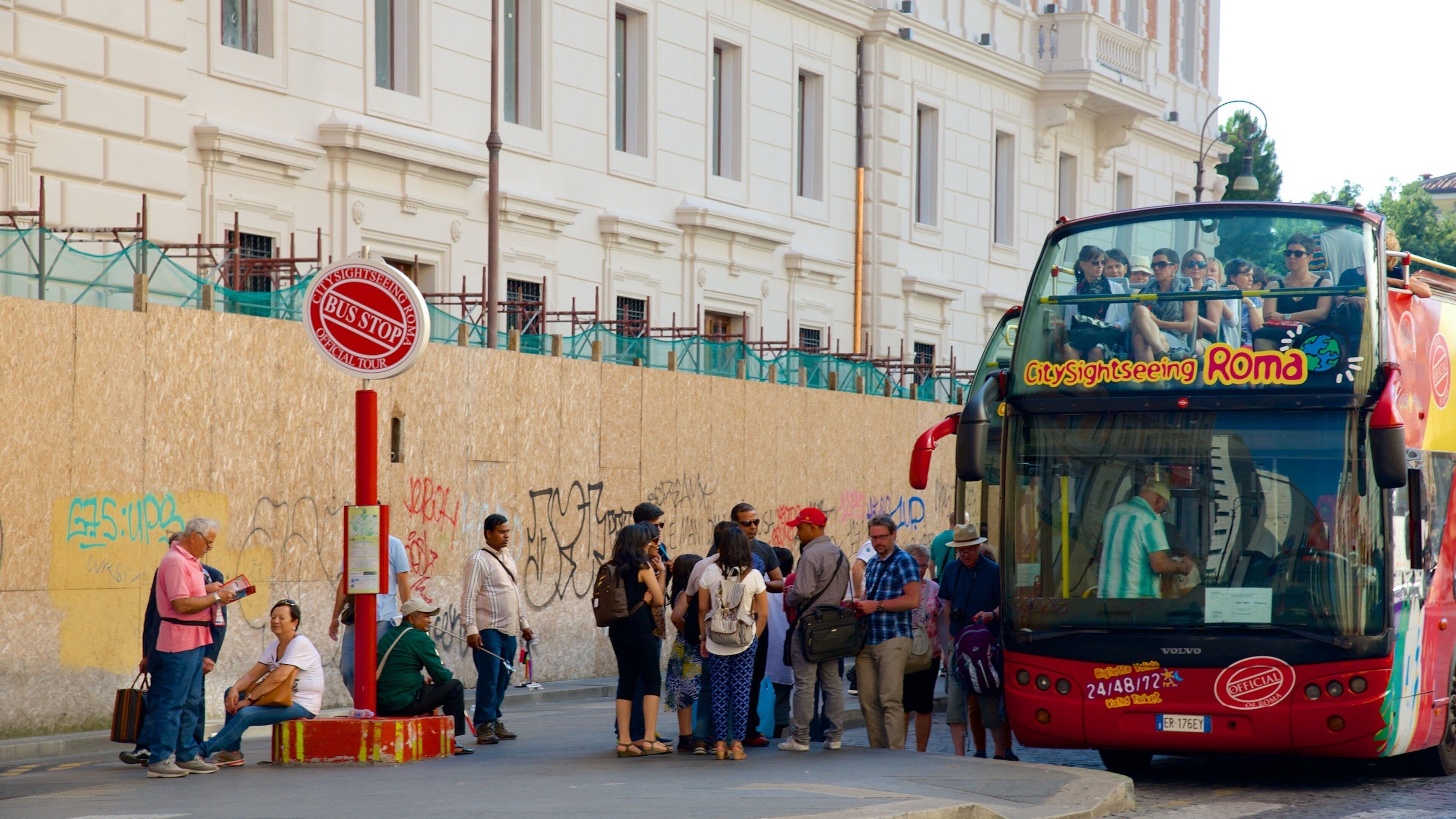 Via Marsala featuring vehicle touring as well as a small group of people