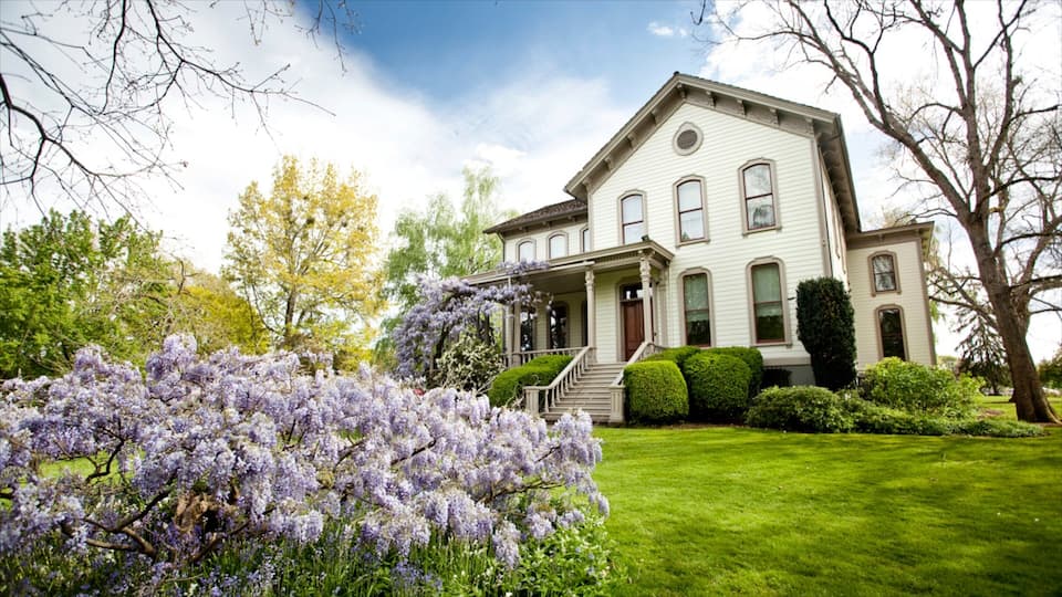 Bush House Museum featuring a house and flowers