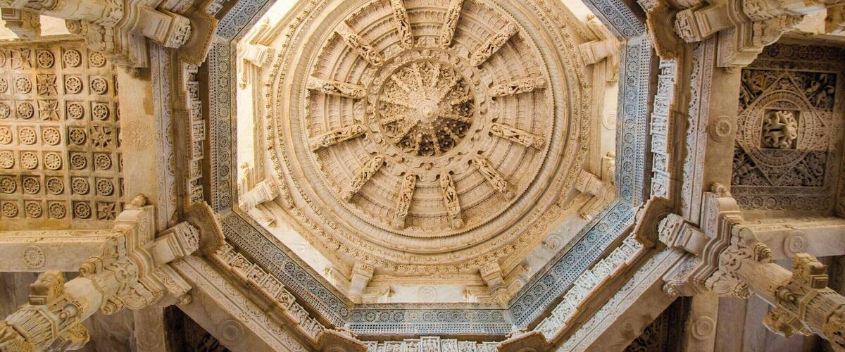 Beautifully carved highest dome supported by eight pillars of massive light-coloured-marble Jain Temple at Ranakpur in Rajasthan (India) was not built by a King or Ruler, instead it is product of a divine vision of a local business person. Temple dates back to 15th century. 1444 marble pillars, carved in exquisite detail, support the temple. The pillars are all differently carved and no two pillars are the same. Also all the statues face one or the other statue. A truly man made miracle somewhere lost on the map of India.
#LifeAtExpedia