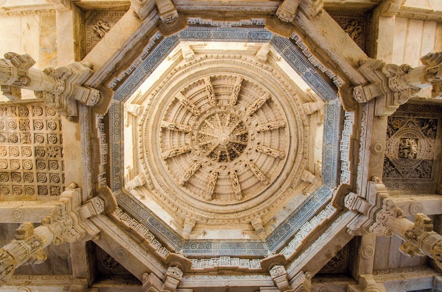 Beautifully carved highest dome supported by eight pillars of massive light-coloured-marble Jain Temple at Ranakpur in Rajasthan (India) was not built by a King or Ruler, instead it is product of a divine vision of a local business person. Temple dates back to 15th century. 1444 marble pillars, carved in exquisite detail, support the temple. The pillars are all differently carved and no two pillars are the same. Also all the statues face one or the other statue. A truly man made miracle somewhere lost on the map of India.
#LifeAtExpedia