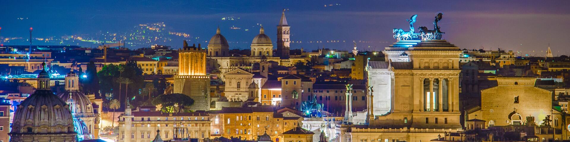 night view over rome taken from the top of gianicolo hill. the most interesting monument on the horizon is snow white vittoriano building with distinct statue on top.