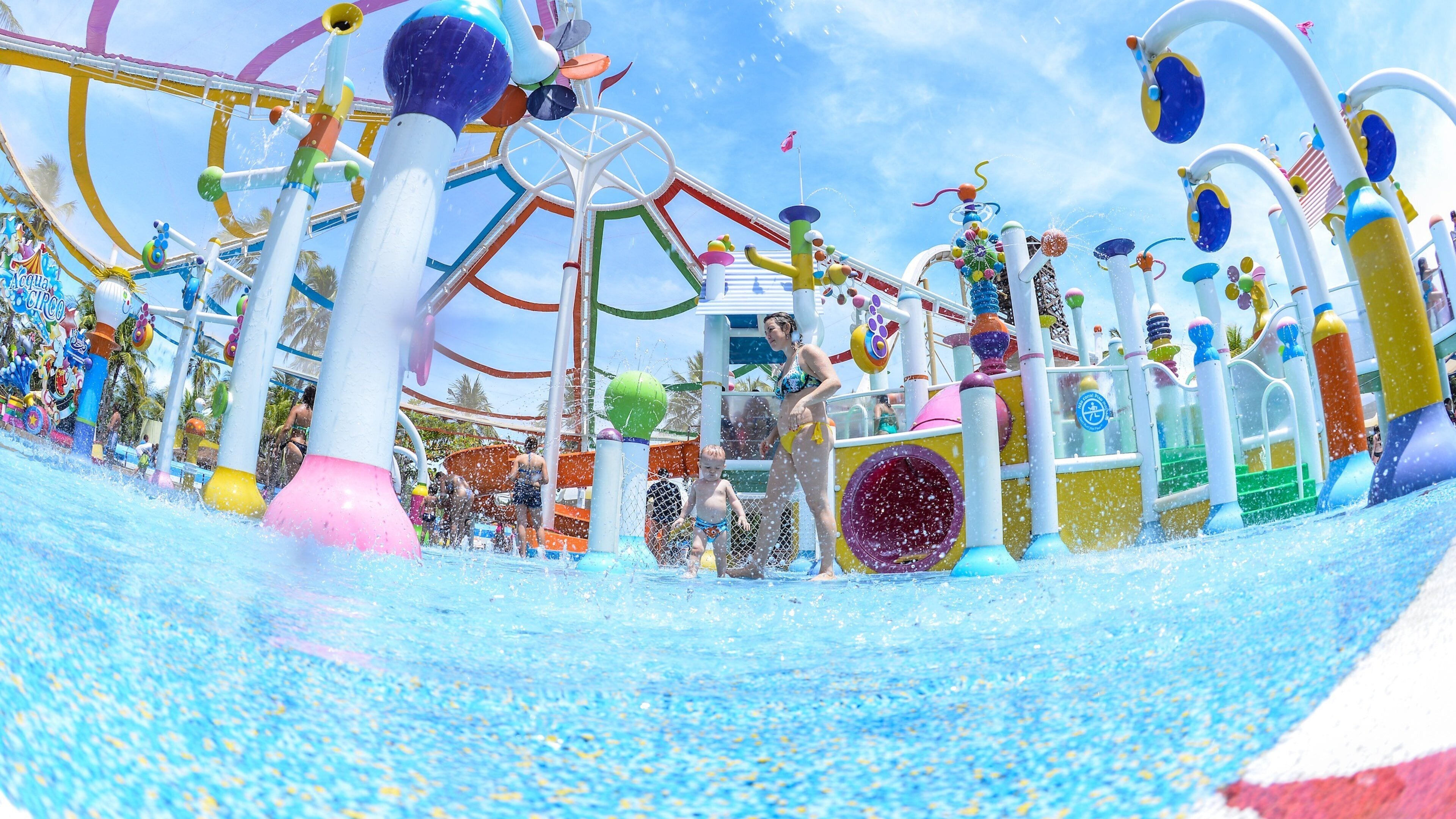 Beach Park Water Park showing a waterpark as well as a family