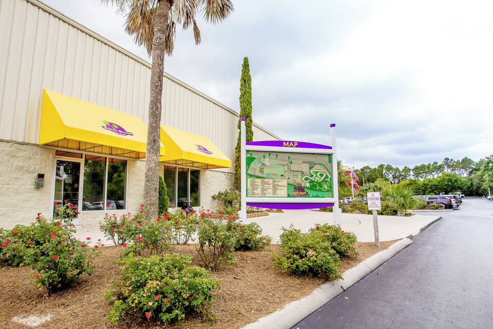 A building with yellow awnings and a map sign.
