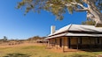 Alice Springs Telegraph Station showing farmland and a small town or village