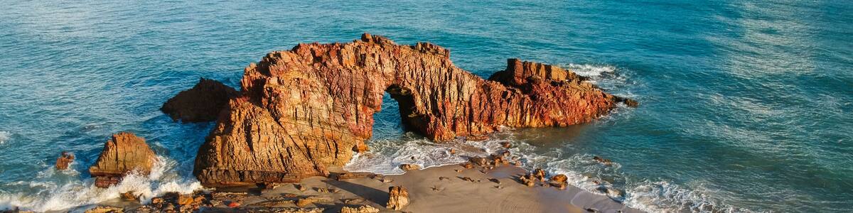 Pedra Furada. Famous touristic attraction on the beach of Jericoacoara, Ceara State, Brazil.