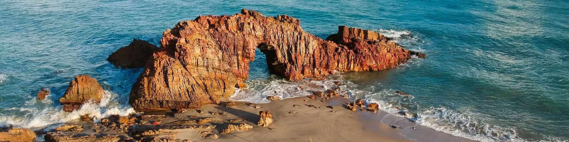 Pedra Furada. Famous touristic attraction on the beach of Jericoacoara, Ceara State, Brazil.