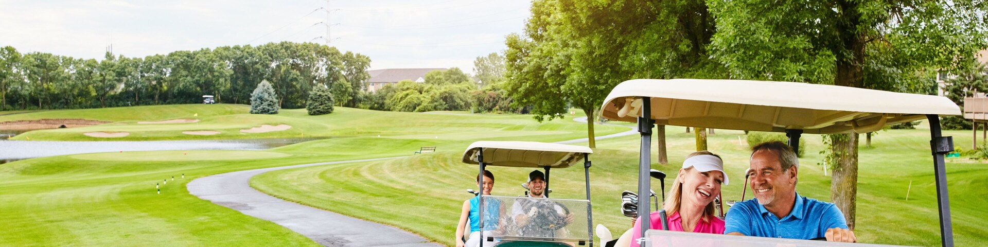 People, golf cart and outside course in nature, happy and relax in transport path or country club hobby on weekend break. Fitness, driving and smile for sport game conversation, golfers and together