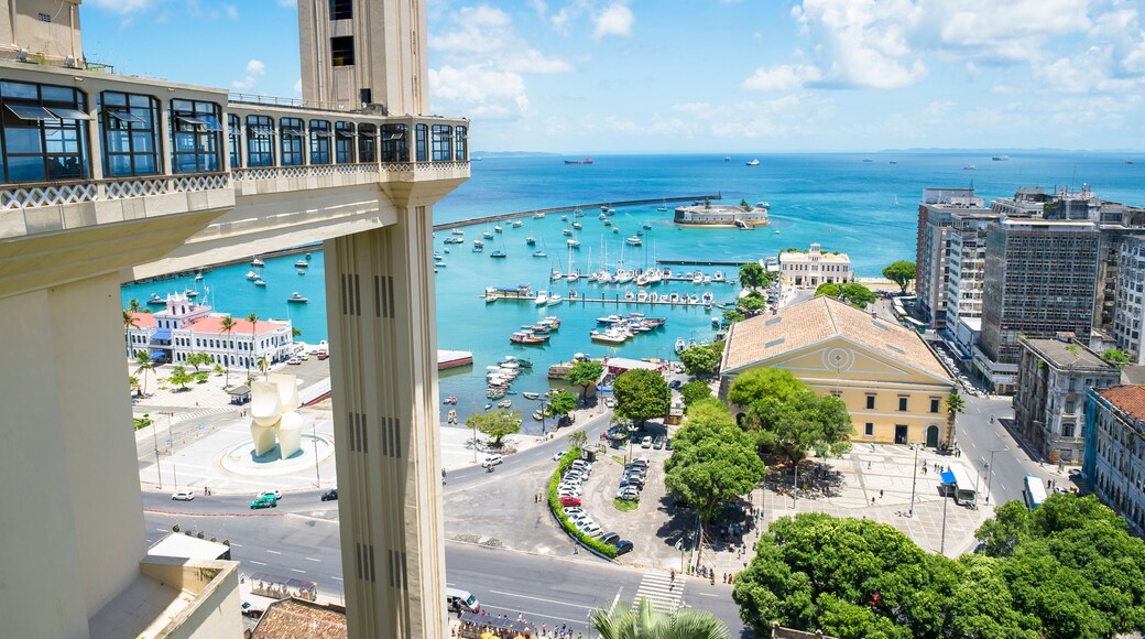 Scenic city skyline view of Salvador, Brazil with Lacerda Elevator, Bay of All Saints, and old Lower City architecture on the horizon