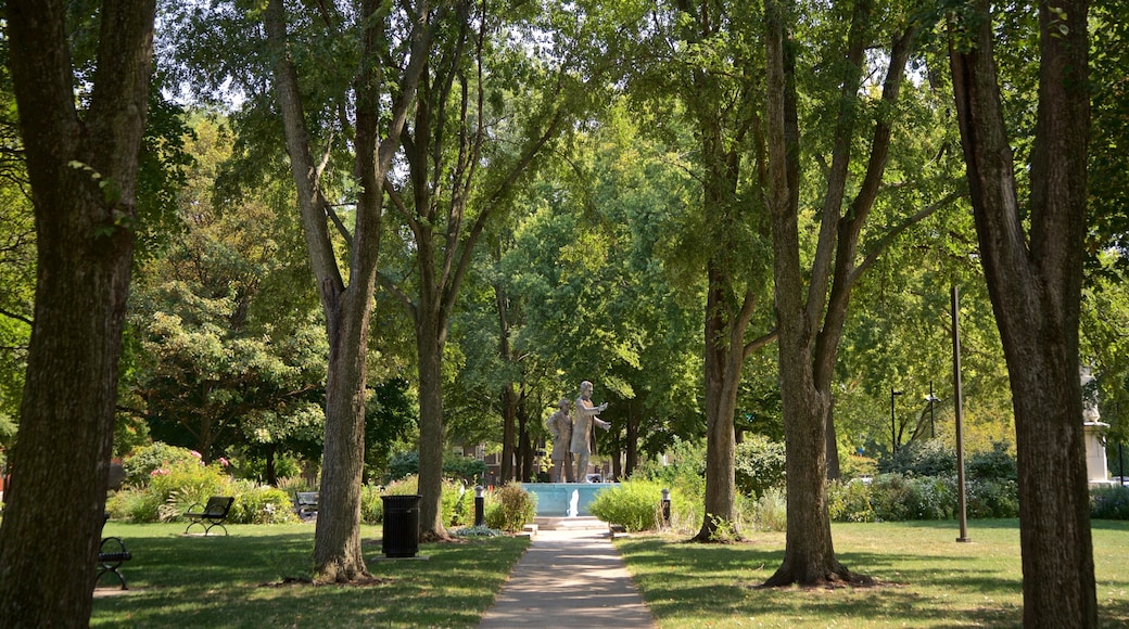 Washington Square Park featuring a garden and a statue or sculpture