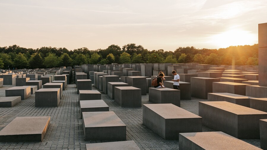 Holocaust Memorial showing a sunset as well as a couple