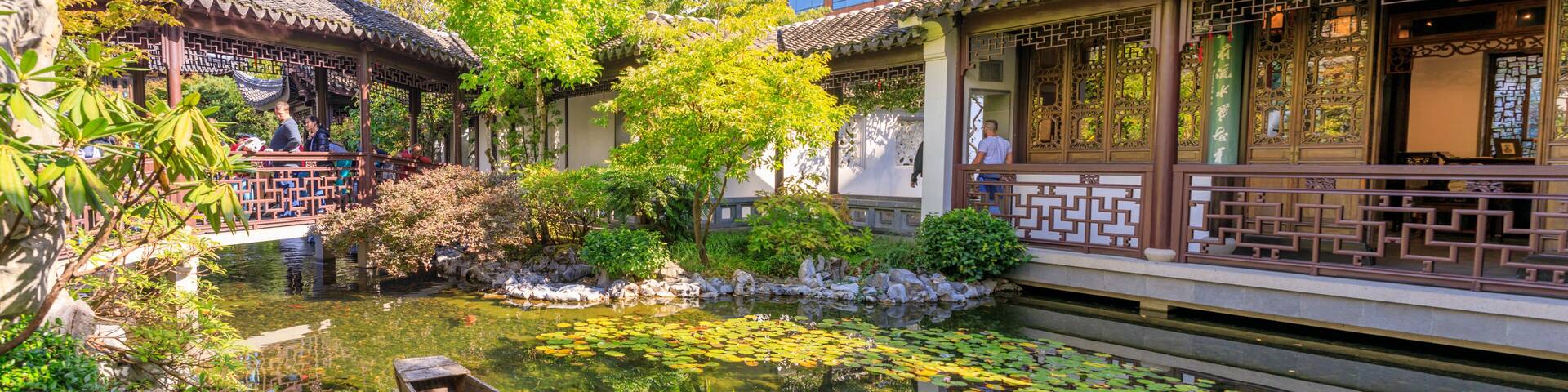Lan Su Chinese Garden in summer season. Garden Pavilion reflects in pond