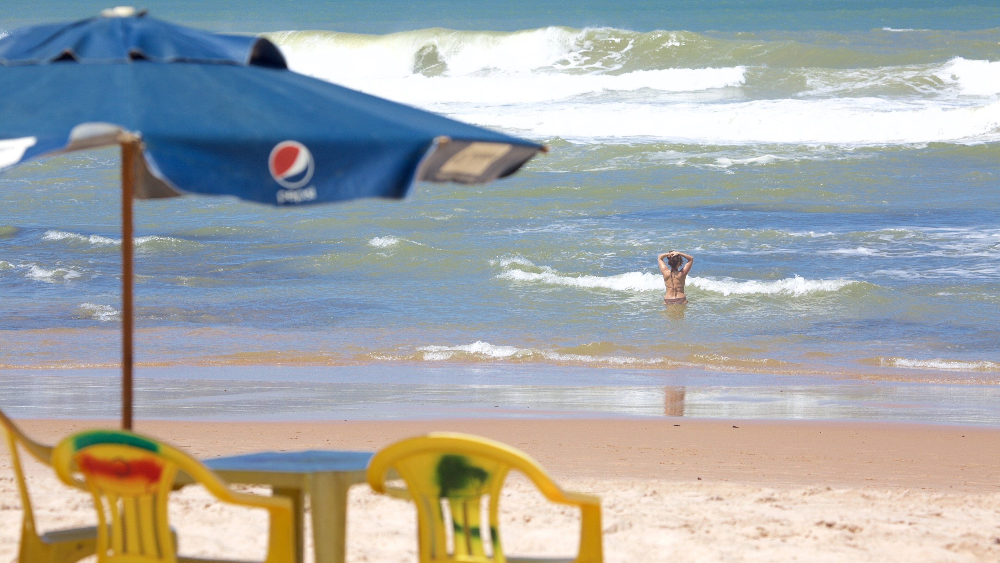 Salvador which includes surf, general coastal views and a sandy beach