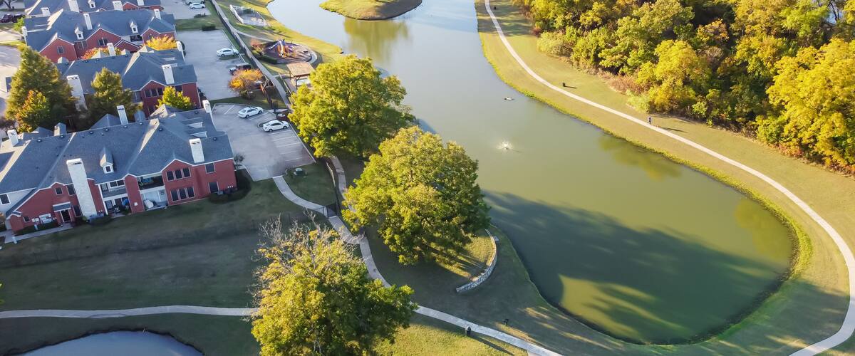 Top view twin lake with little island near park front apartment building in suburbs Dallas, Texas, USA