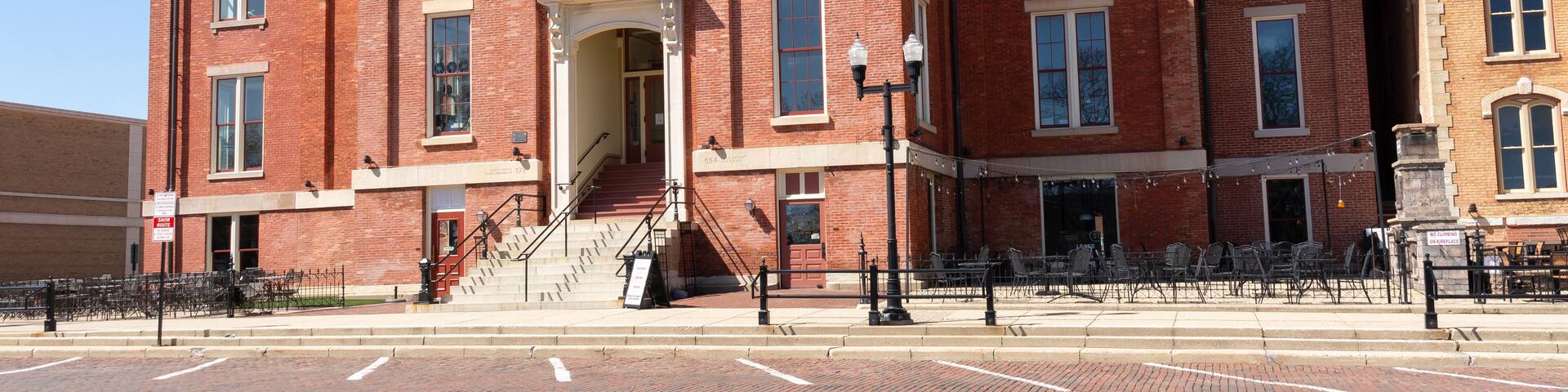 Woodstock, Illinois - United States - April 8th, 2024: Exterior of the historical Old McHenry County Courthouse, built in 1857, in Woodstock, Illinois, USA.
