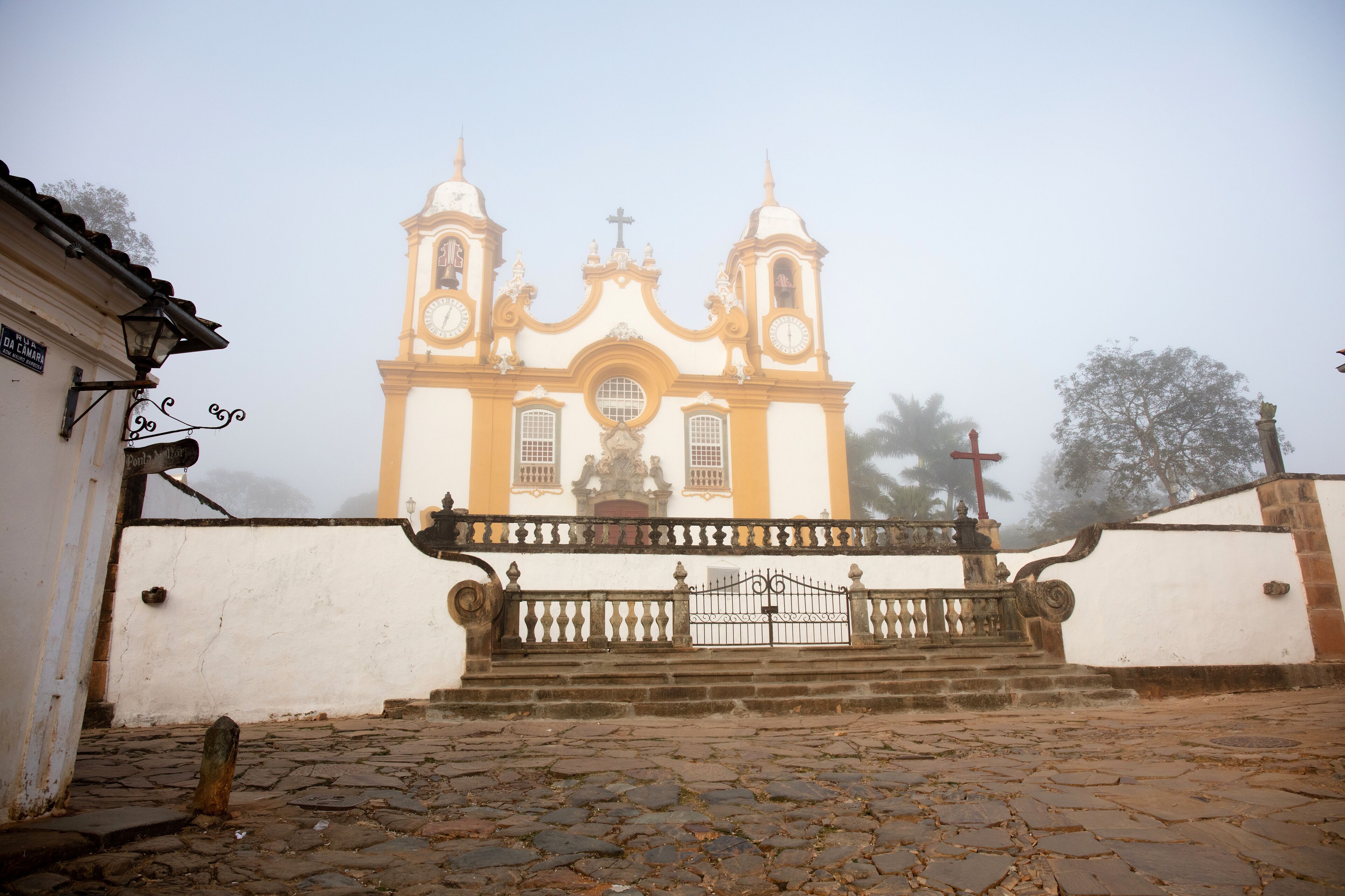 Fog with a view of the Santo Antonio Catholic Church in the city of Tiradentes in Minas Gerais