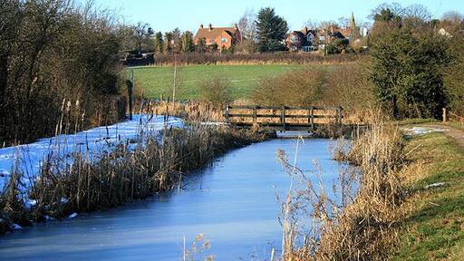 Footbridge Over The Nottingham Canal With the village of Cossall behind.
