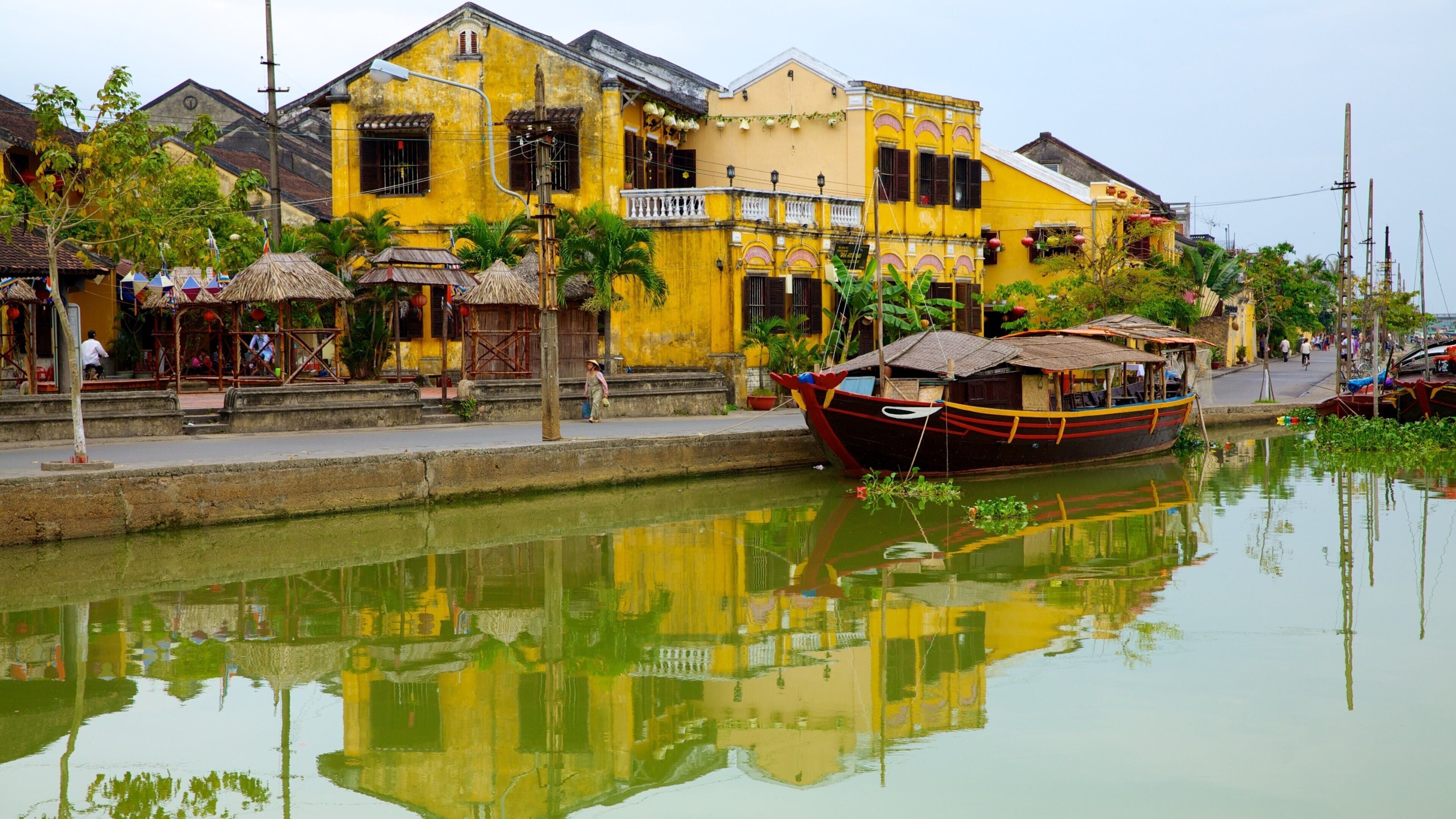 Hoi An Ancient Town featuring a coastal town, hiking or walking and a river or creek