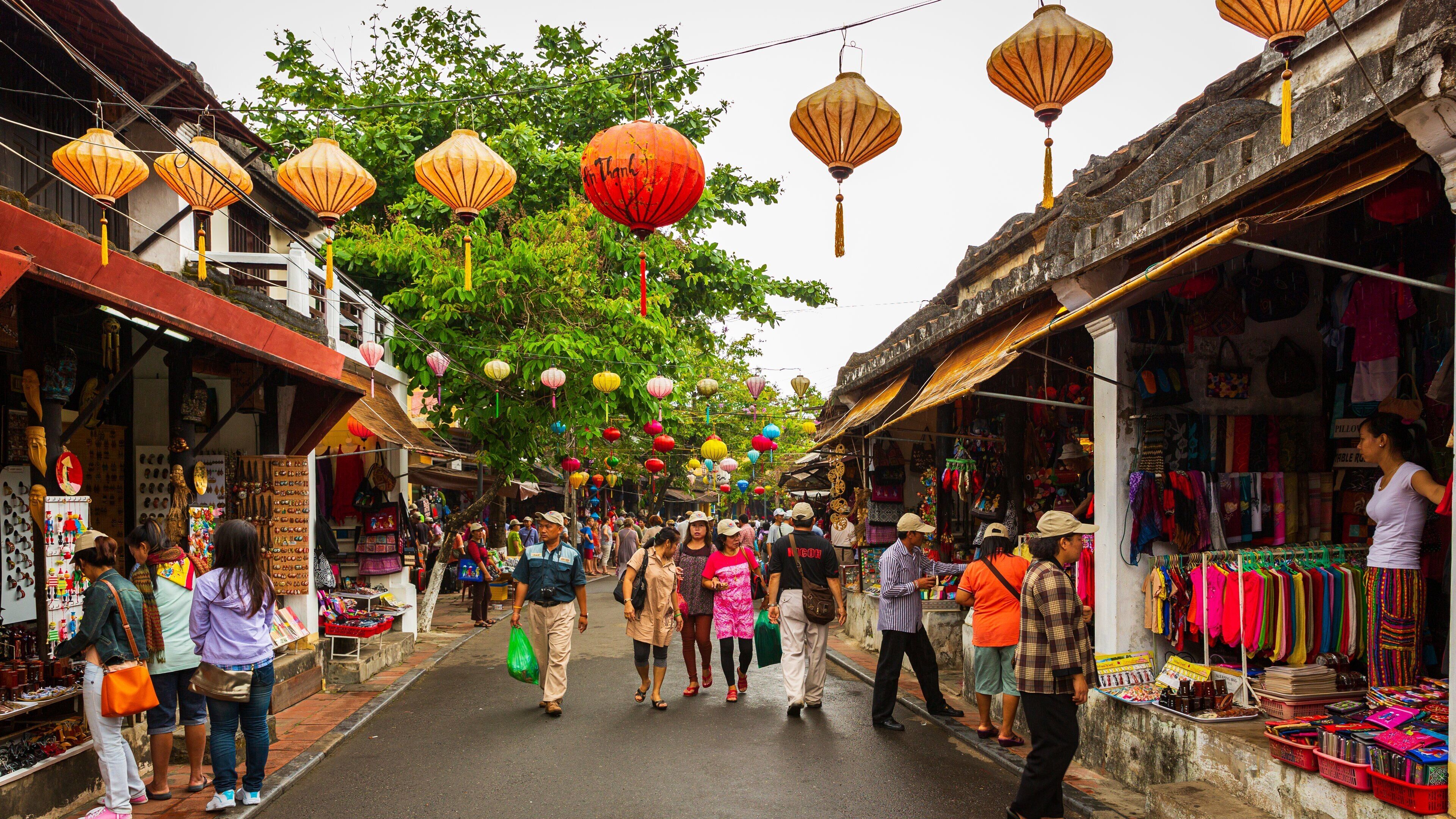 Hoi An Ancient Town which includes street scenes and markets as well as a small group of people