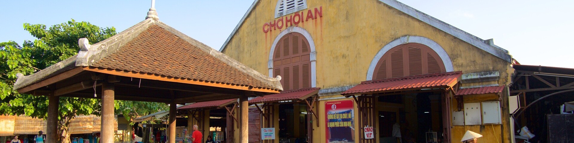 Central Market showing signage, cycling and a small town or village
