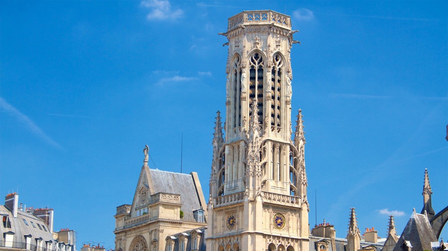 A tall, ornate tower with intricate architectural details and a clock face.