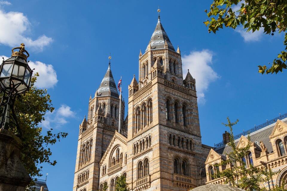 A historic building with two prominent towers and intricate architectural details.