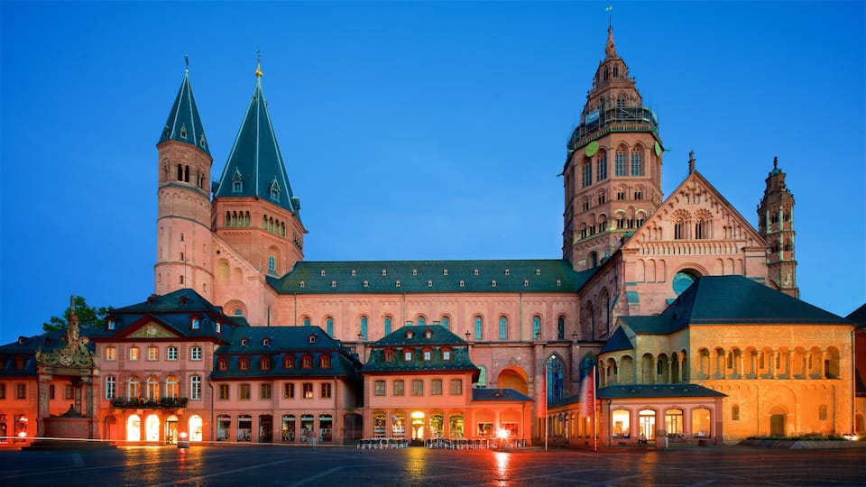 A historic building with multiple towers and a large courtyard.