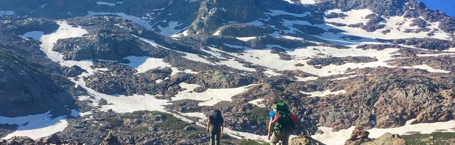 Stage 4 of the GR20 leaves the Asco ski station, heads up toward Monte Cinto, over Bocca Crucetta and down the other side to Auberge U Vallone. This photo was taken midway through the ascent to Bocca Crucetta. After a serious accident in 2015 when seven people were killed, the traditional stage four route through the infamous Cirque De La Solitude was rerouted to this stage four variant. Although this route is not nearly as difficult as the previous I still found it to be a long and strenuous 
section. 
#mountains photo challenge 
#hiking