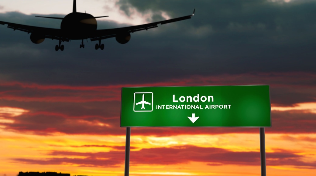 Plane landing in London England, UK airport with signboard
