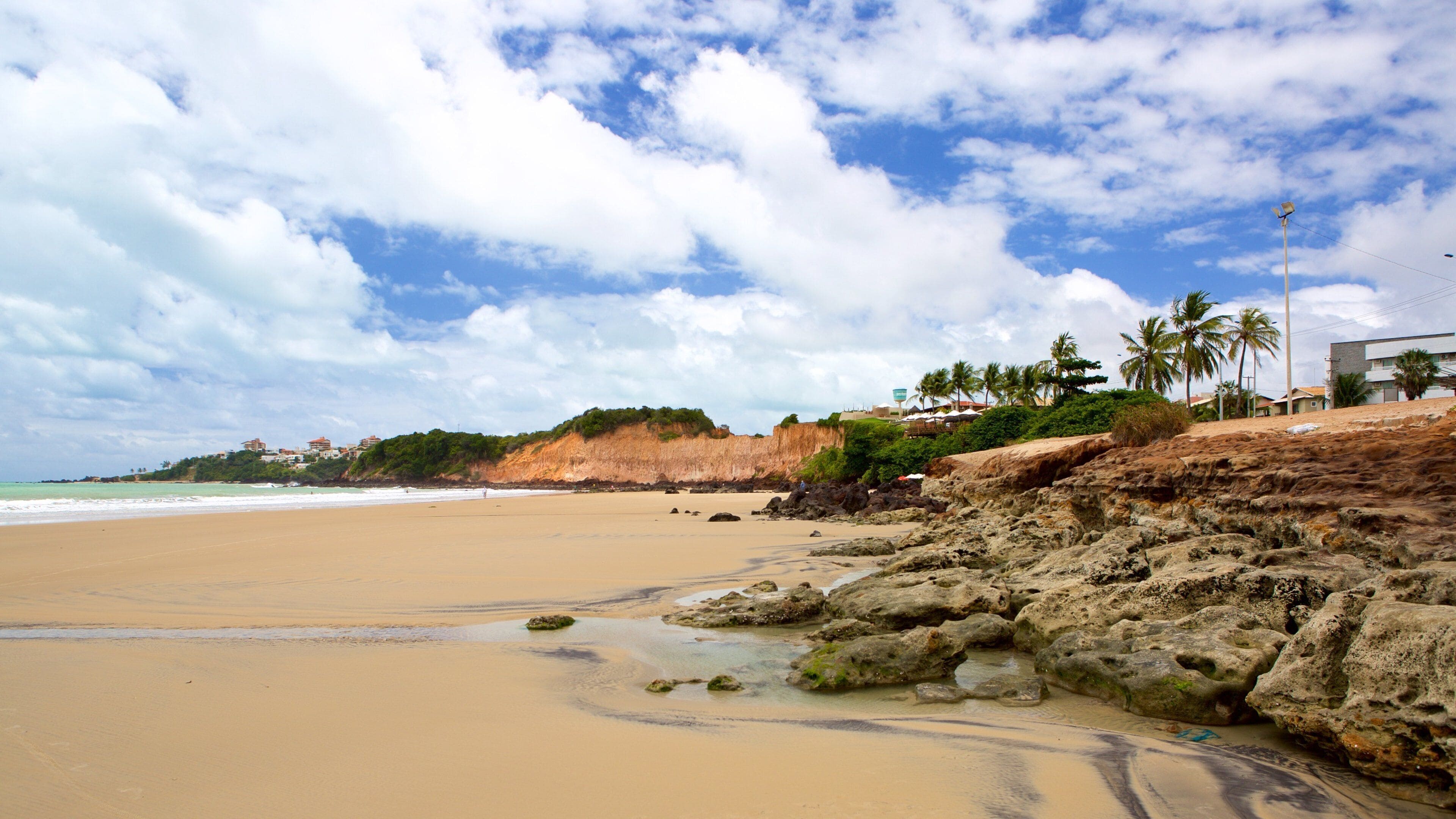 Cotovelo Beach which includes a sandy beach and general coastal views