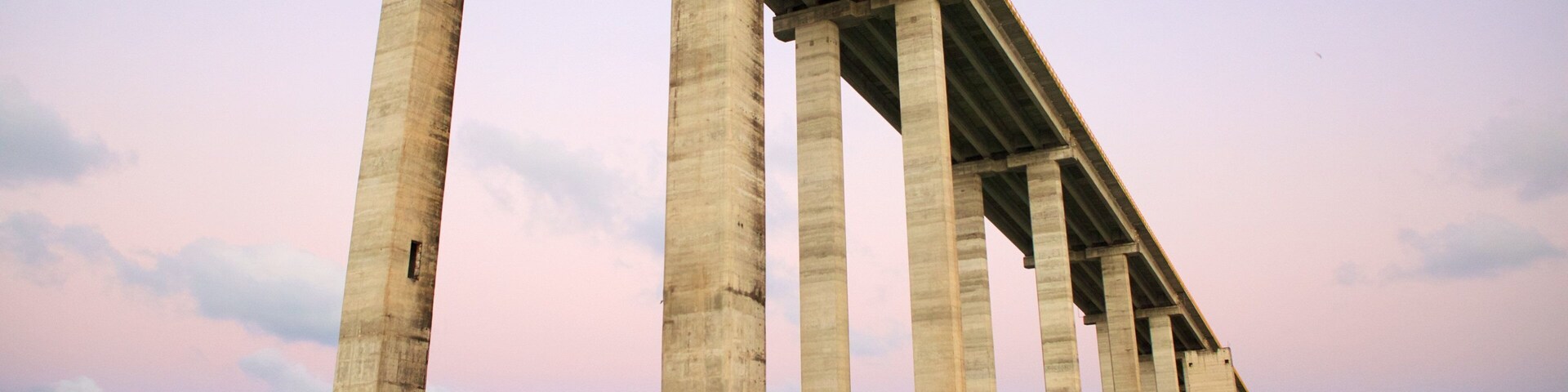 Newton Navarro Bridge which includes a bridge, general coastal views and a bay or harbor